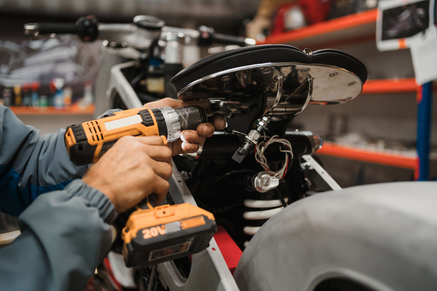 Mechanic servicing motorcycle with genuine KAP spare parts Kasur